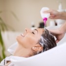 Portrait of women which wash hair in a beauty salon.Hairdresser washing hair.